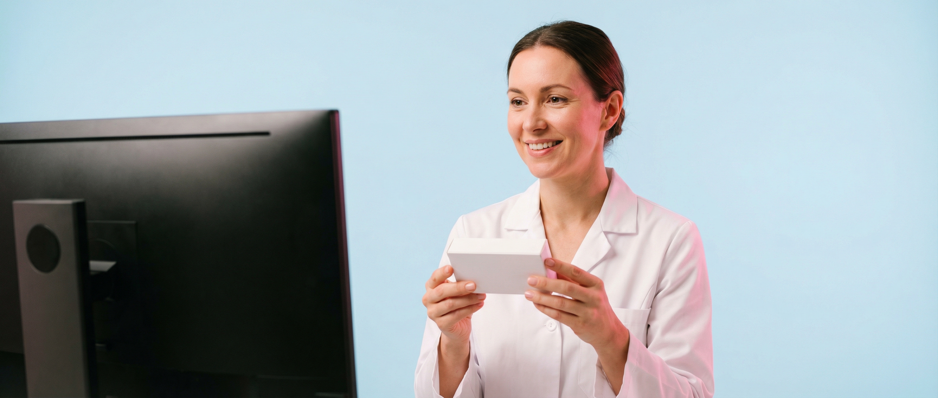 Pharmacist reviewing medication at the counter
