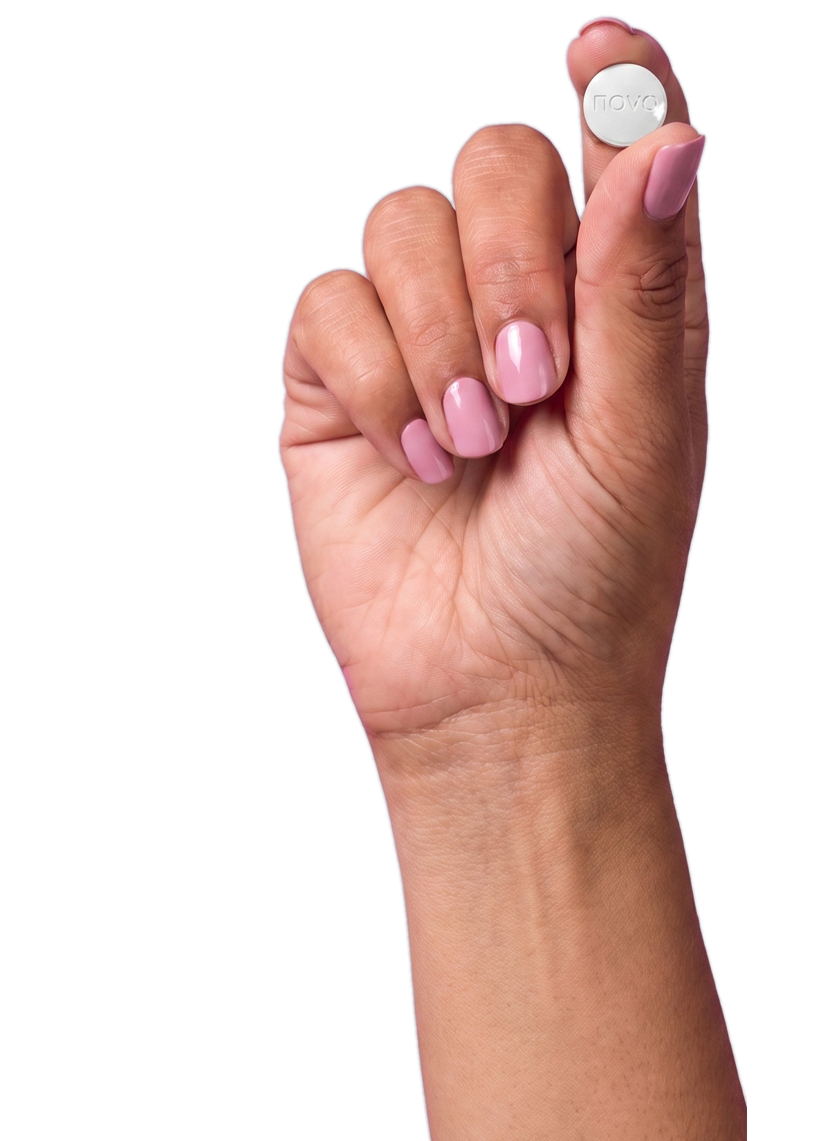 Hand holding up a small once-daily oral weight loss tablet